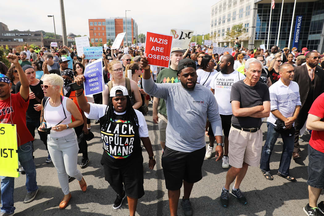 Thousands of protesters march in Boston against a planned 'Free Speech Rally'.