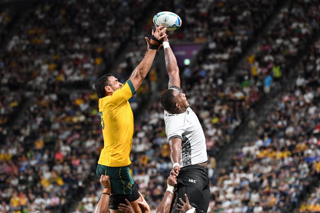 Fiji's lock Leone Nakarawa and Australia's Rory Arnold compete for the ball during their Rugby World Cup match in Sapporo.