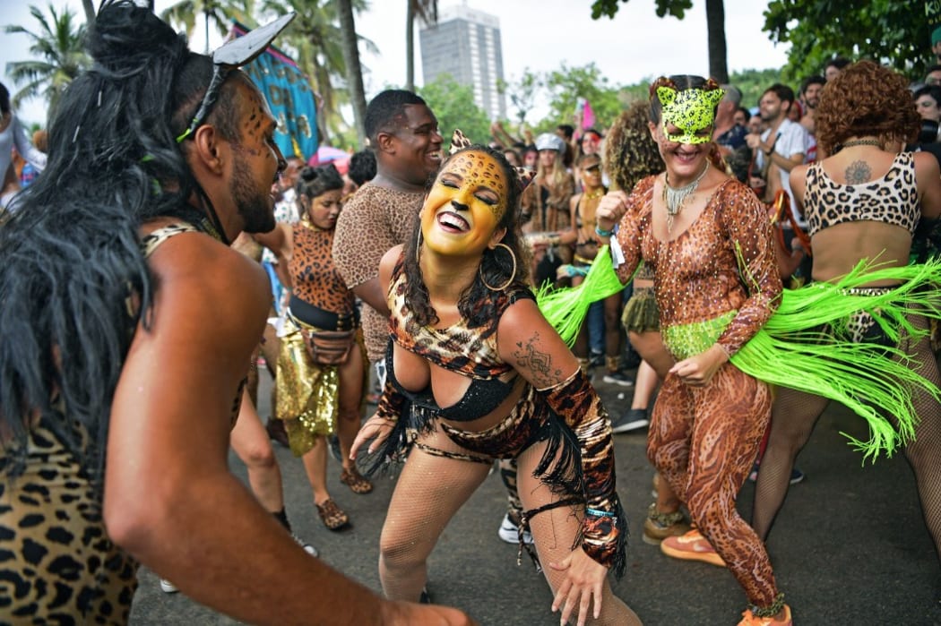 Revellers cheer during the Amigos da Onca street party in Rio de Janeiro, Brazil.