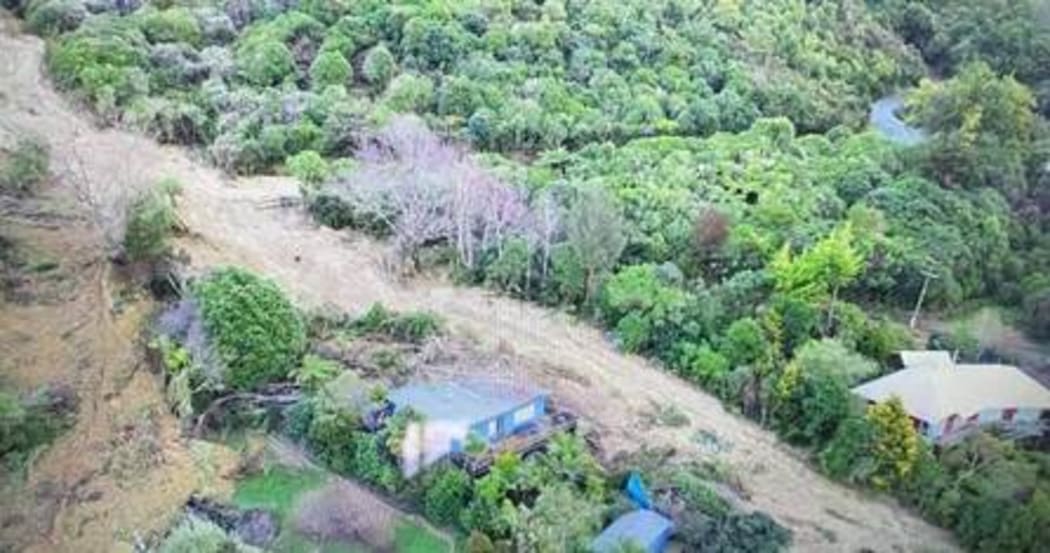 A road, turned into a stream, near Queen Charlotte Drive, Marlborough.