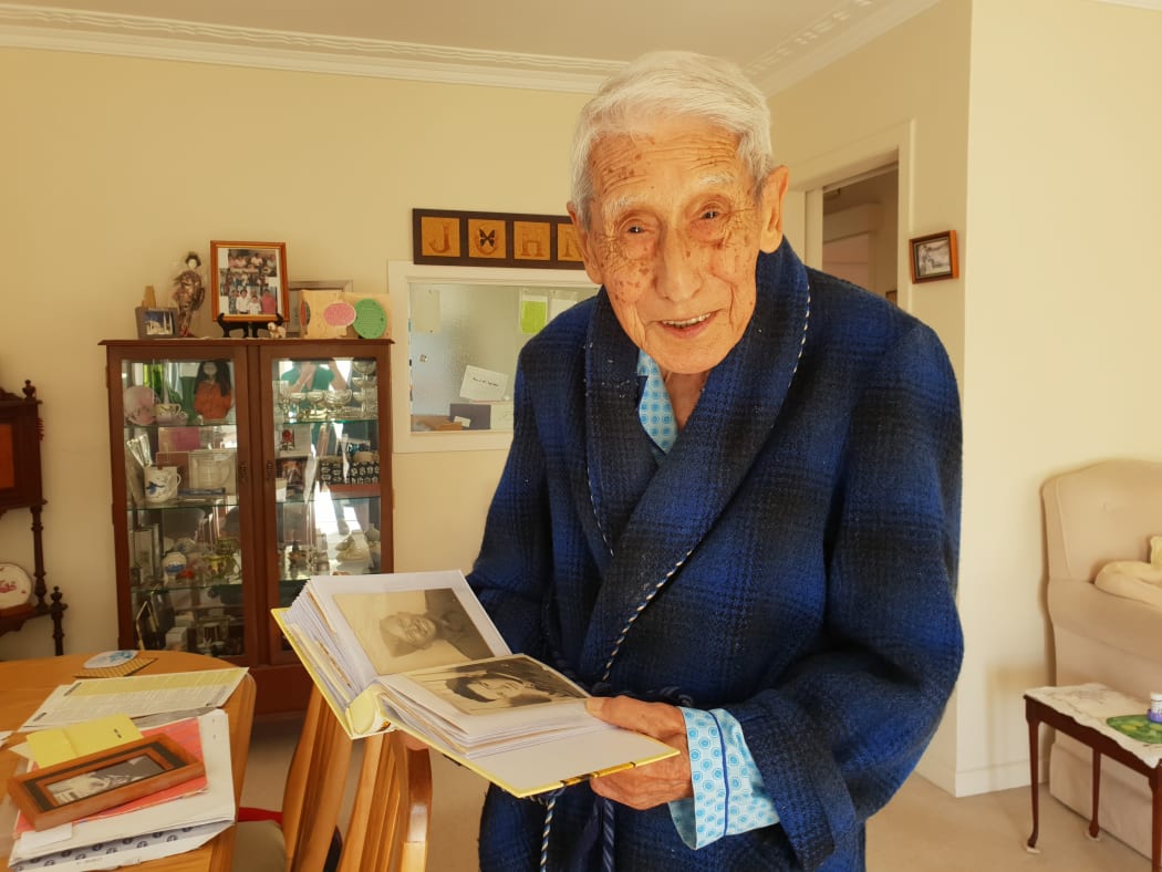 John Sato was supported by police and a helper to show his support for the Muslim community.