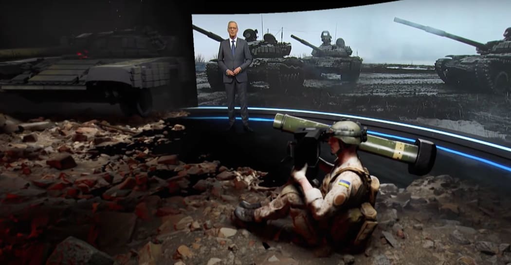 TVNZ 1 News puts host Simon Dallow into an augmented reality Ukrainian battlefield to demonstrate how Javelin missiles work.