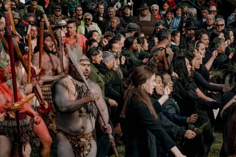 Tūhoe people perform a haka in Tāneatua.