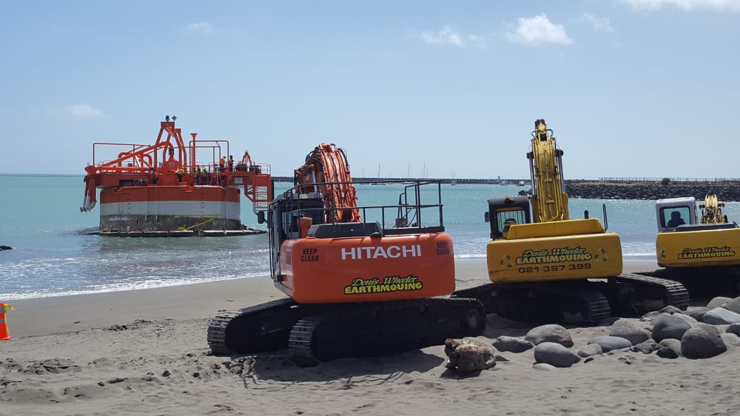 Three diggers and two tug boats were used to refloat the 250 tonne buoy.