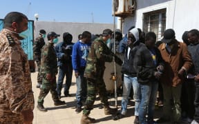Migrants in Tripoli after their boat was intercepted at sea and brought back to Libya in April.