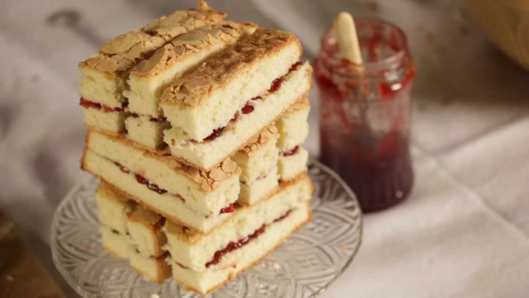 A sandwich tower made of Victoria sponge.