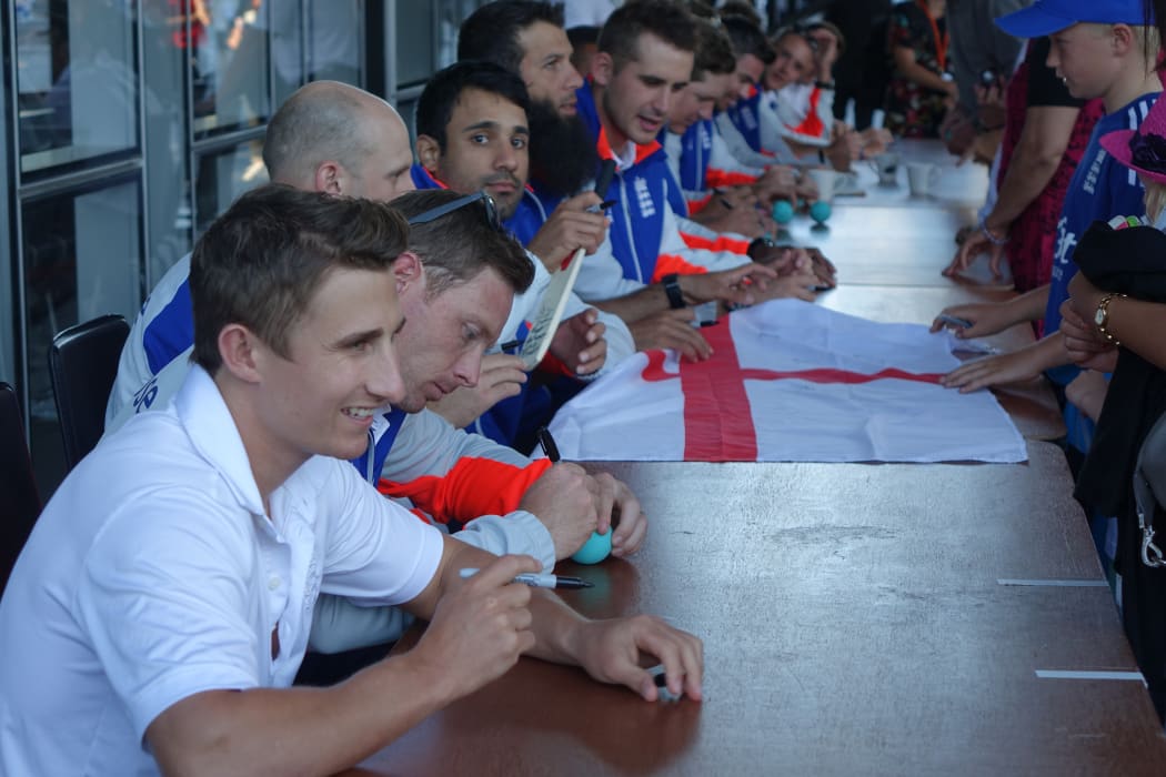 England giving autographs to fans. From left James Taylor, Ian Bell, James Treadwell, Ravi Bopara, Moeen Ali and Alex Hales.
