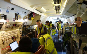 Inside NASA's DC-8 aircraft, which is conducting a worldwide survey of the earth's atmosphere.