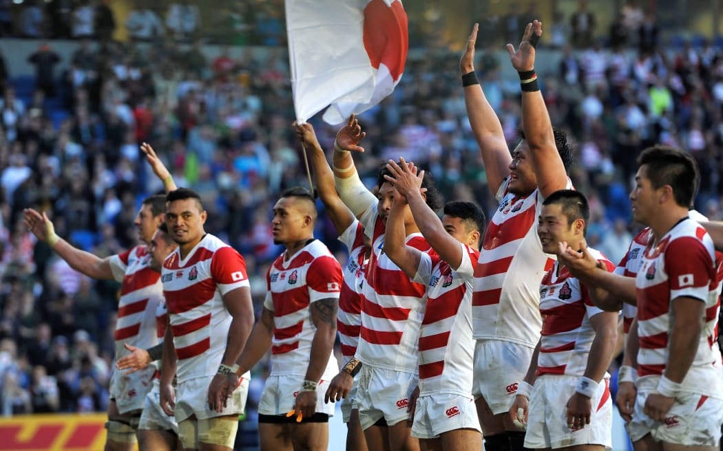 The Japan team celebrate with the crowd after their World Cup pool match win over South Africa at the 2015 tournament.