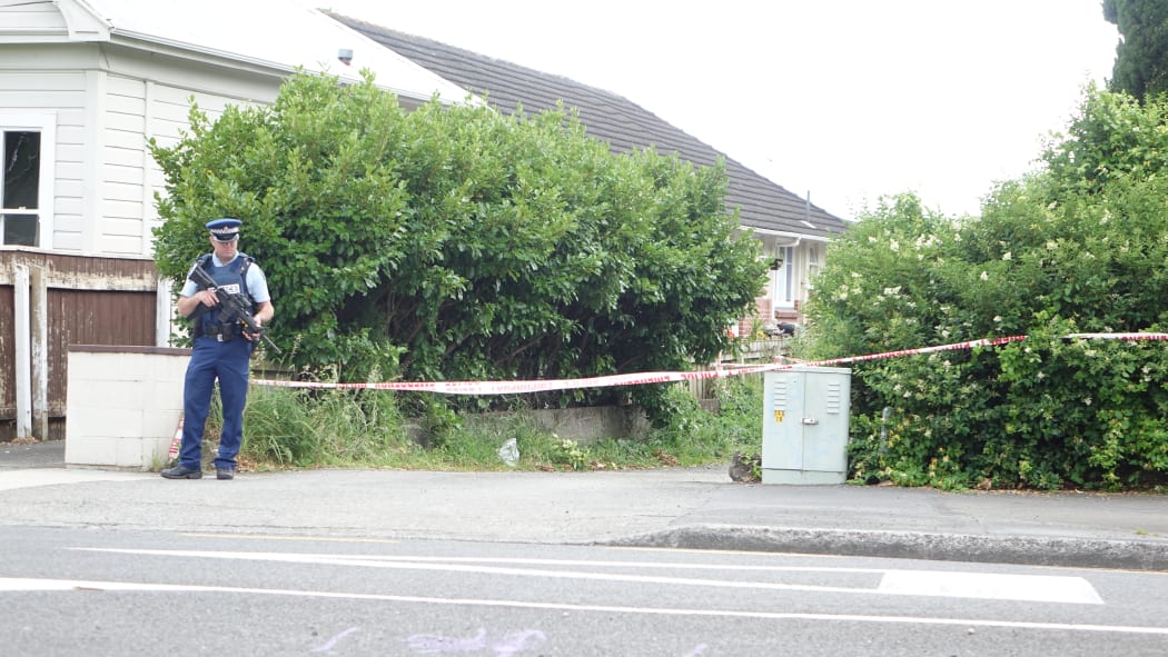 Armed police guard the cordon in Ward Street, near Heretaunga College in Upper Hutt.