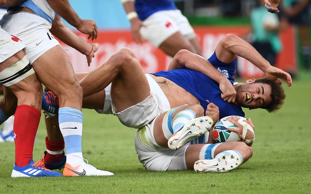 French wing Damian Penaud is tackled during the match against Argentina.