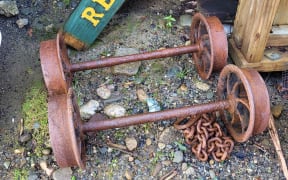 Caption: A man has been fined after attempting to steal artifacts including metal wheels, axles and a chain from the Denniston Mine on the West Coast.
 
Credit: Supplied/Department of Conservation