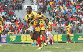 PNG Hunters halfback Watson Boas shapes to kick.