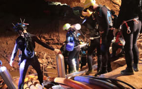 Photo taken recently by the Royal Thai Navy on 7 July, 2018 shows a group of Thai Navy divers in Tham Luang cave during rescue operations for the 12 boys and their football team coach trapped in the cave.