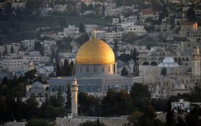 A picture taken on April 14, 2014 at the sunset shows the golden Dome of the Rock in the compound known to Muslims as al-Haram al-Sharif (Noble Sanctuary) and to Jews as the Temple Mount in Jerusalem's old city.