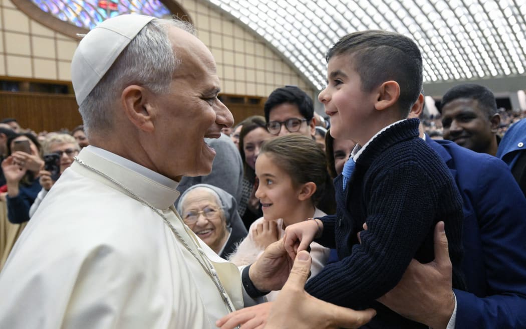 Pope Leo XIV receives employees of the Roman Curia, the SCV Governorate, and the Vicariate of Rome in the Paul VI Hall for Christmas greetings in 2025 in Vatican on December 22, 2025. Photograph by VATICAN MEDIA/ CPP / HANS LUCAS.
Le pape Leon XIV recoit les employes de la Curie romaine, du Gouvernorat de la SCV et du Vicariat de Rome dans la salle Paul VI pour les vœux de Noel 2025 au Vatican, le 22 decembre 2025. Photographie de VATICAN MEDIA/ CPP / HANS LUCAS. (Photo by Vatican Media / CPP / HANS LUCAS / Hans Lucas via AFP)