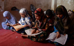 Children study inside a Madrassa or Islamic school in Kandahar on 20 April, 2022.