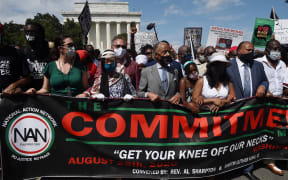 Rev. Al Sharpton (C), Yolanda King (3-R), granddaughter of Martin Luther King Jr., Andrea Waters King (2-R) and Martin Luther King, III (R), march with others on August 28, 2020, in Washington, DC.