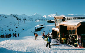 Skiers and snowboarders at Whakapapa skifield on Mt Ruapehu.