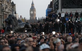 People gather for a vigil in Trafalgar Square in central London on March 23, 2017 in solidarity with the victims of the March 22 terror attack at the British parliament and on Westminster Bridge. Britain's parliament reopened on Thursday with a minute's silence in a gesture of defiance.