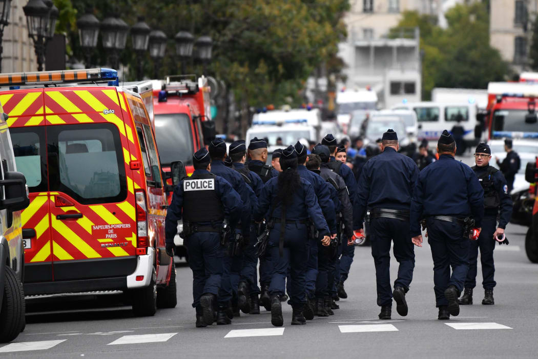 Police and military personnel block the bridge near Paris Police headquarters after four officers were killed in a knife attack on October 3, 2019 in Paris, France.