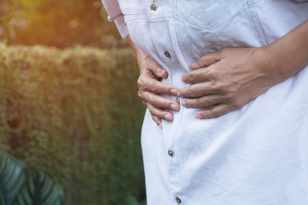 Male suffering from stomachache pain.