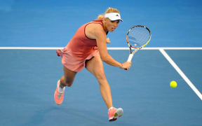 Caroline Wozniacki prepares for the ball at the ASB Tennis Centre