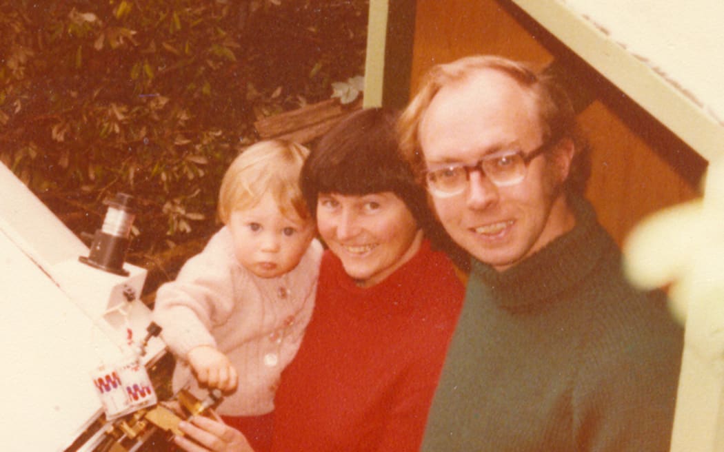 Kilmartin and Gilmore with Ned and their telescope at their home in Happy Valley, Wellington in 1979