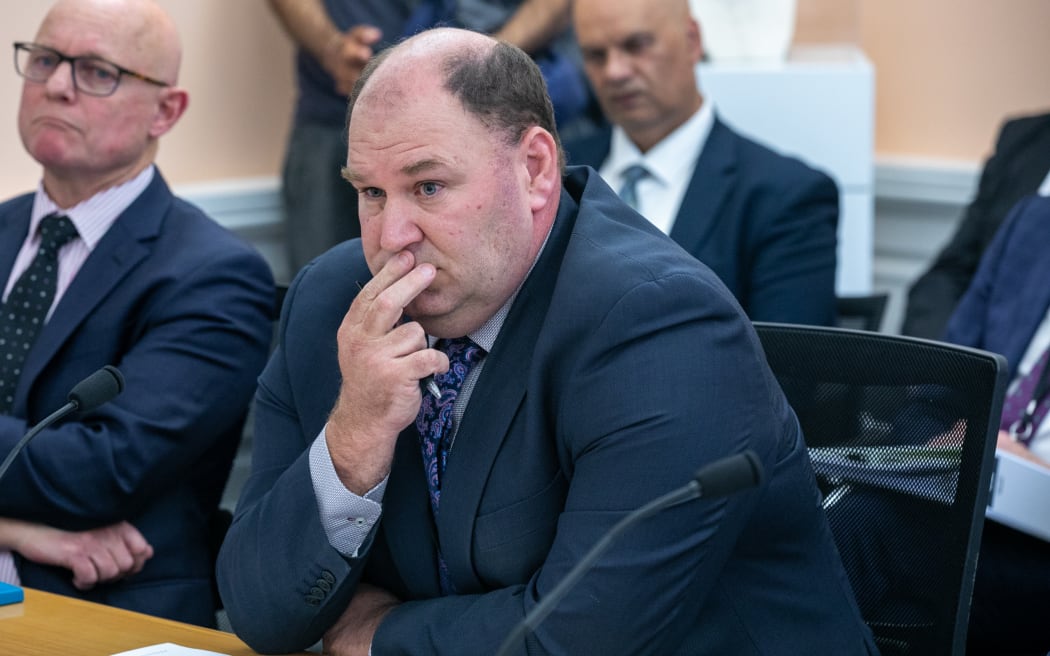 Andrew Hoggard answers questions during a scrutiny week hearing on MPI.