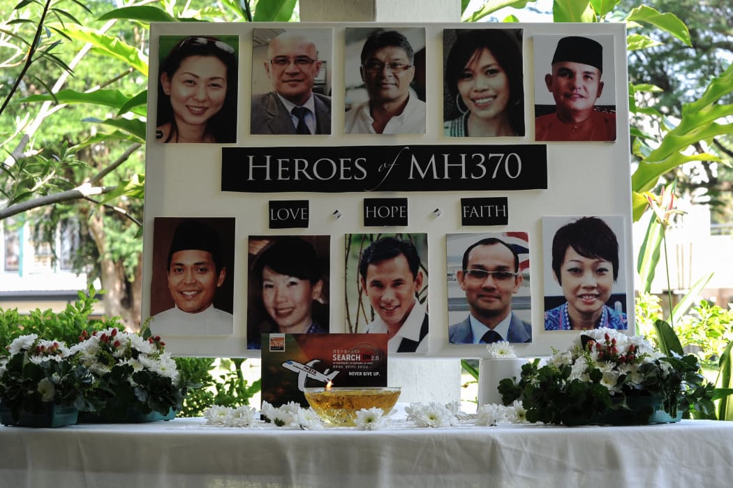 A poster showing cabin crew from Malaysia Airlines flight MH370 is displayed during a prayer at a school in Petaling Jaya on 8 March 2016.