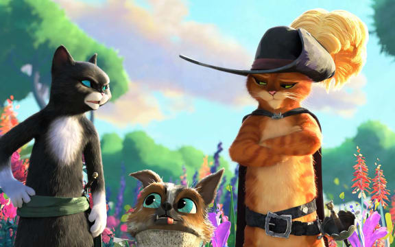 From left to right, Kitty Softpaws, Perrito the chihuahua, and Puss from the film Puss in Boots: The Last Wish