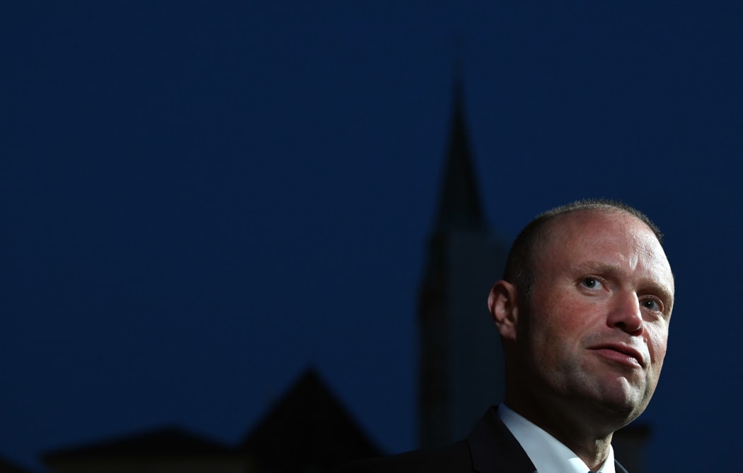 (FILES) This file photo taken on September 19, 2018 shows Malta's Prime Minister Joseph Muscat speaking to the media as he arrives at the Felsenreitschule prior to their informal dinner as part of the EU Informal Summit of Heads of State or Government in Salzburg, Austria.
