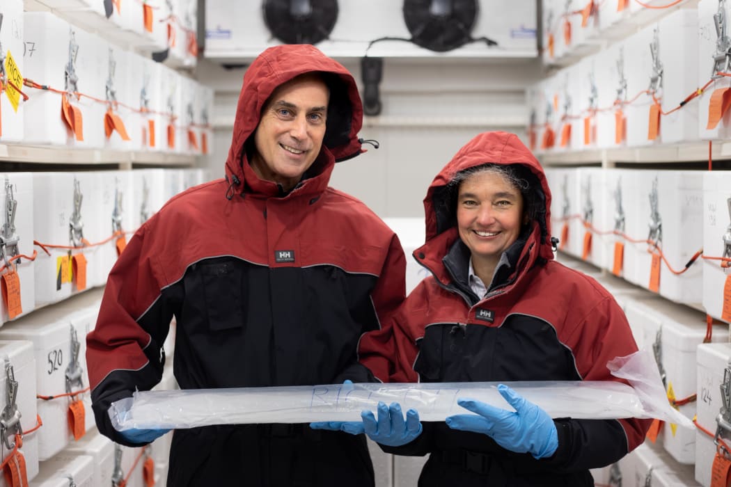 Nancy Bertler and Richard Levy hold an ice core collected from Antarctica which holds a record of past climate.