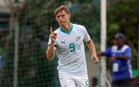 New Zealand's Ben Waine scores and celebrates his goal.