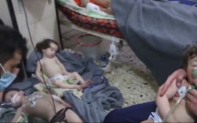 Affected Syrian children receive medical treatment following the apparent chemical attack in Douma.