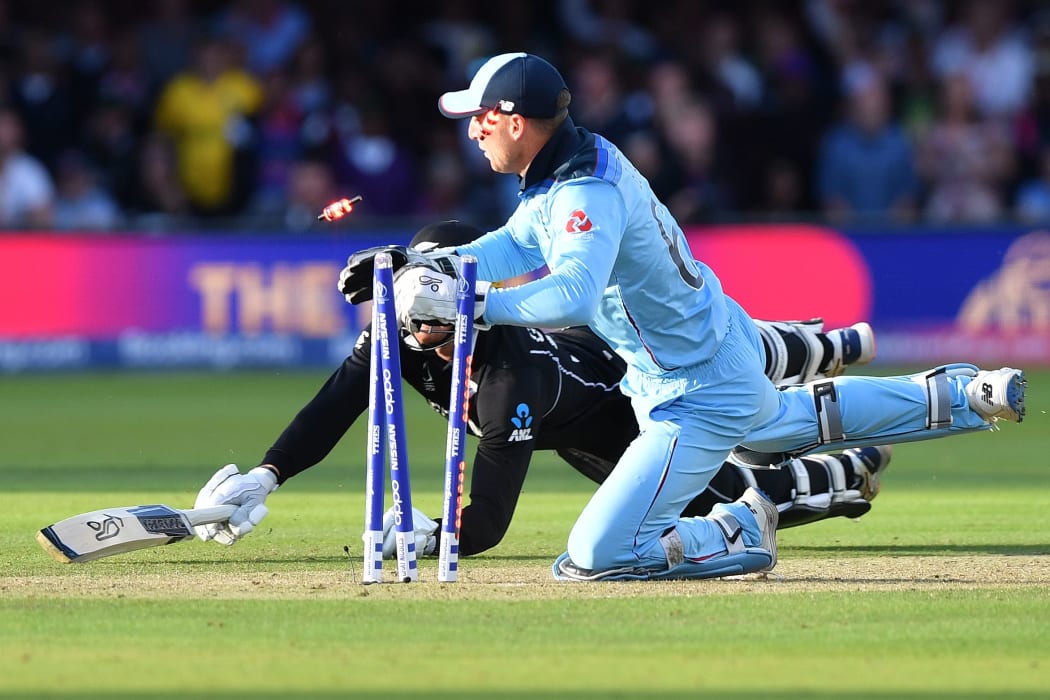 England's Jos Buttler runs out New Zealand's Martin Guptill to win the super-over to win the 2019 Cricket World Cup final.