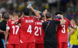 Tunisia’s players take part in the hydratation break during the 2026 World Cup Group F football match between Sweden and Tunisia at the Monterrey Stadium in Guadalupe on June 14, 2026.  (Photo by Julio Cesar AGUILAR / AFP)