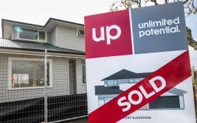 Sold sign outside a new house being built in East Auckland