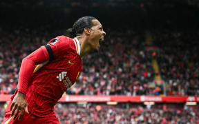Liverpool defender Virgil van Dijk celebrates after scoring his team's second goal during the English Premier League football match against West Ham at Anfield, 14 April, 2025.
