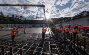 Concrete being poured at Watercare's Redoubt Road complex where an additional water storage reservoir is being built, February 2023.