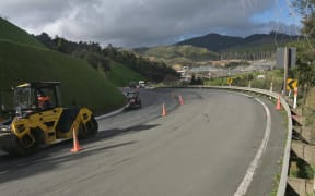 Asphalt is laid on the newly created shoulder alongside State Highway 1 over the Brynderwyn Hills. Photo: Supplied / NZTA