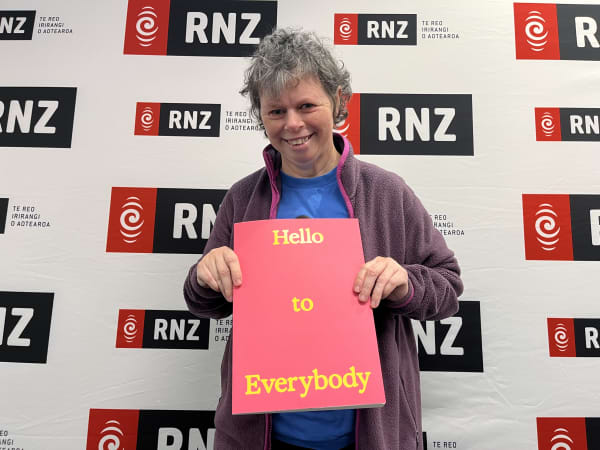 Wellington artist Sallie Culy with her book Hello To Everybody