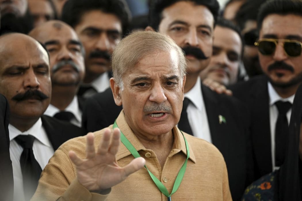 Pakistan's opposition leader Shehbaz Sharif speaks with the media before attending a hearing outside the Supreme Court building in Islamabad on April 7, 2022.