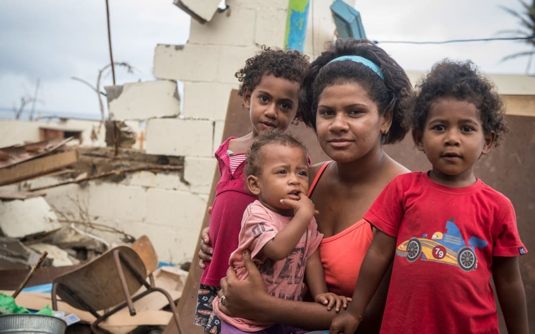 23 year-old housewife Eseta Kaitani, with her daughters Faith, 4, Ulamila, 3, and Sova, 1, at the Tuatua Nasau Primary School in Koro.