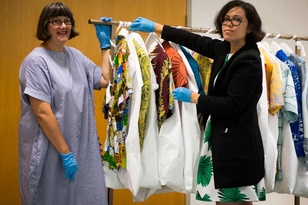 Claire Regnault and Sonya Withers with Te Papa's collection of Aloha Shirts
