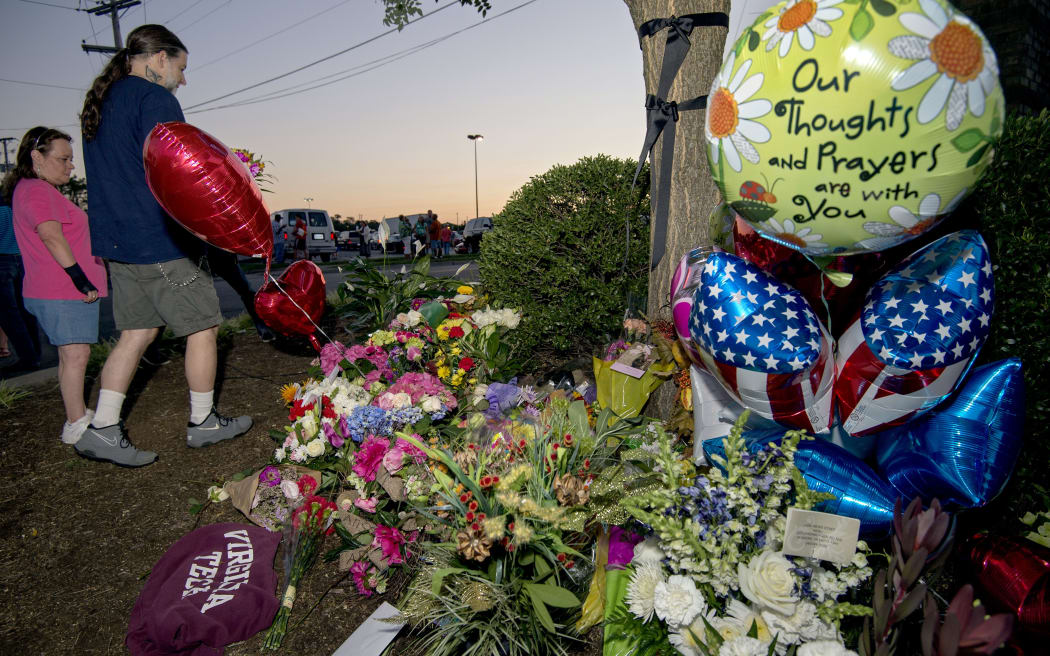 Virginia residents pay their respects at a makeshift memorial for reporter Alison Parker and cameraman Adam Ward.