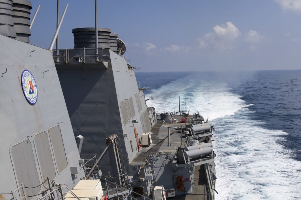 A file photo of a US Navy destroyer during a live-fire exercise on 2 February 2017.