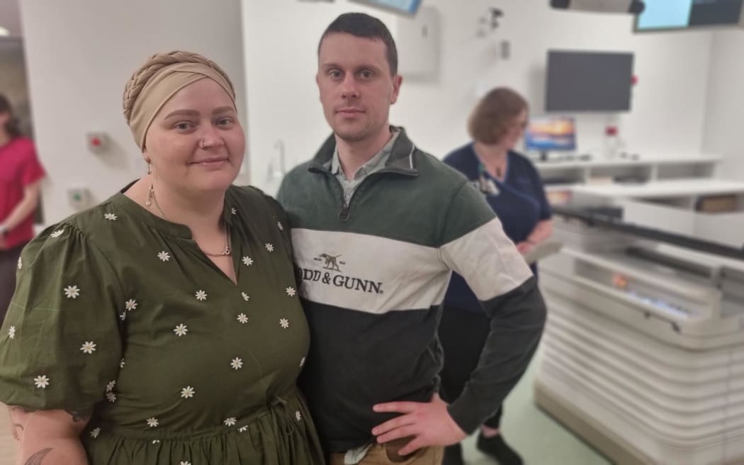 Hannah Watson and partner Neil Goode check out the LINAC machine at the new Taranaki Cancer Centre.