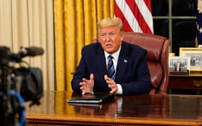 US President Donald Trump addresses the Nation from the Oval Office about the widening novel coronavirus (Covid-19) crisis in Washington, DC on March 11, 2020.