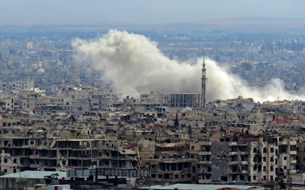 Smoke rising from the rebel-held enclave of Eastern Ghouta on the outskirts of Damascus.